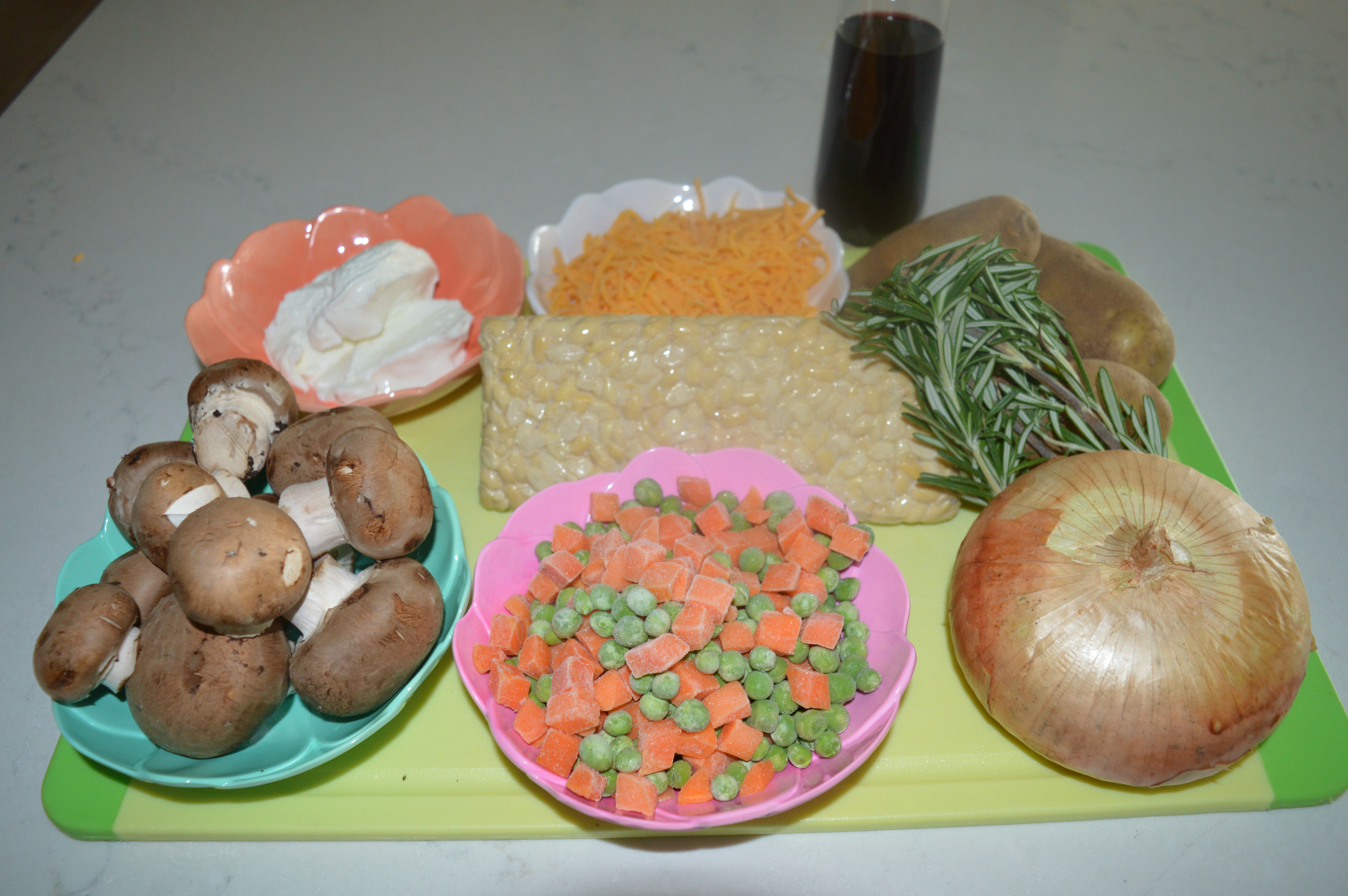 ingredients for tempeh shepherd's pie on a green cutting board