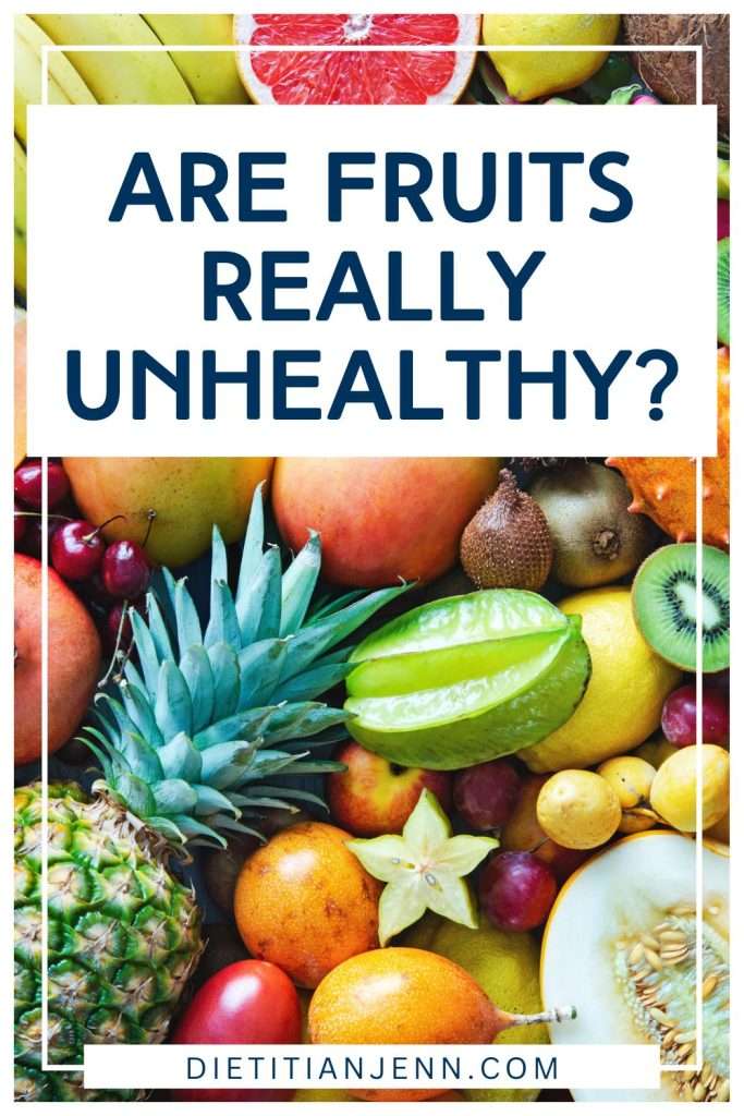 A variety of fruits completely covering the surface, overlaid with the text "are fruits really unhealthy?"