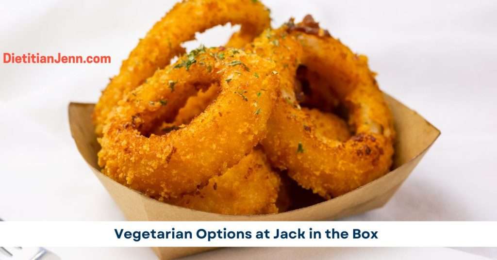 onion rings in a brown cardboard dish garnished with herbs, text overlay reads "vegetarian options at jack in the box"
