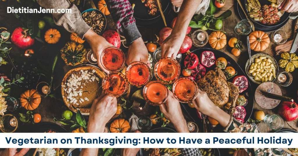 6 hands clinking white wine glasses over a varied Thanksgiving feast, including vegetarian dishes and a small turkey. Overlaid text reads, "Vegetarian on Thanksgiving: How to Have a Peaceful Holiday"