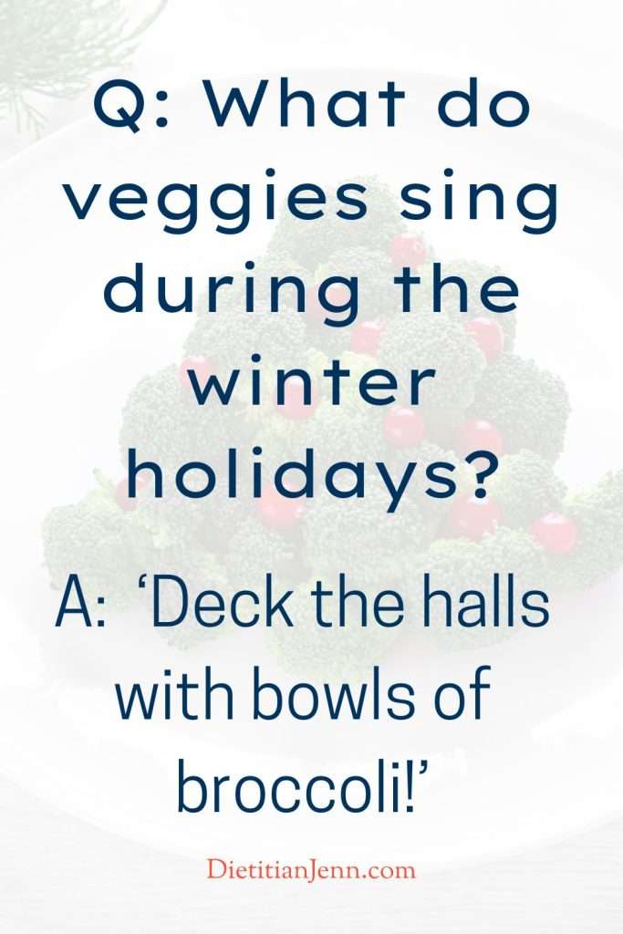 "Q: What do veggies sing during the winter holidays? A: ‘Deck the halls with bowls of broccoli!’" overlaid on an image of broccoli in a Christmas tree shape decorated with cherry tomatoes on a white plate.