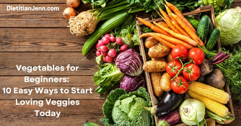 a variety of veggies, some are in a crate, others around it, all on a wooden surface. White text reads, "vegetables for beginners: 10 easy ways to start loving veggies today"