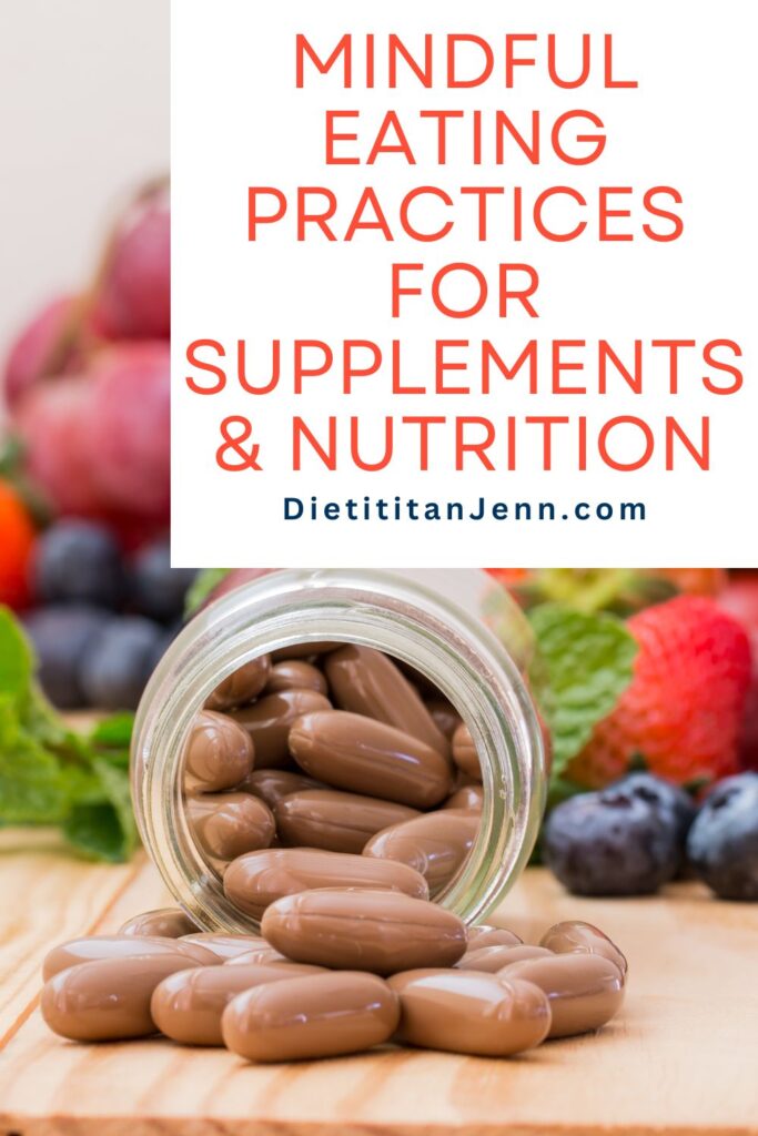 A supplement bottle on its side on a wooden surface with brown capsules spilling out. The background is out of focus berries and vegetables. Overlaid text reads, "Mindful Eating Practices for Supplements & Nutrition"