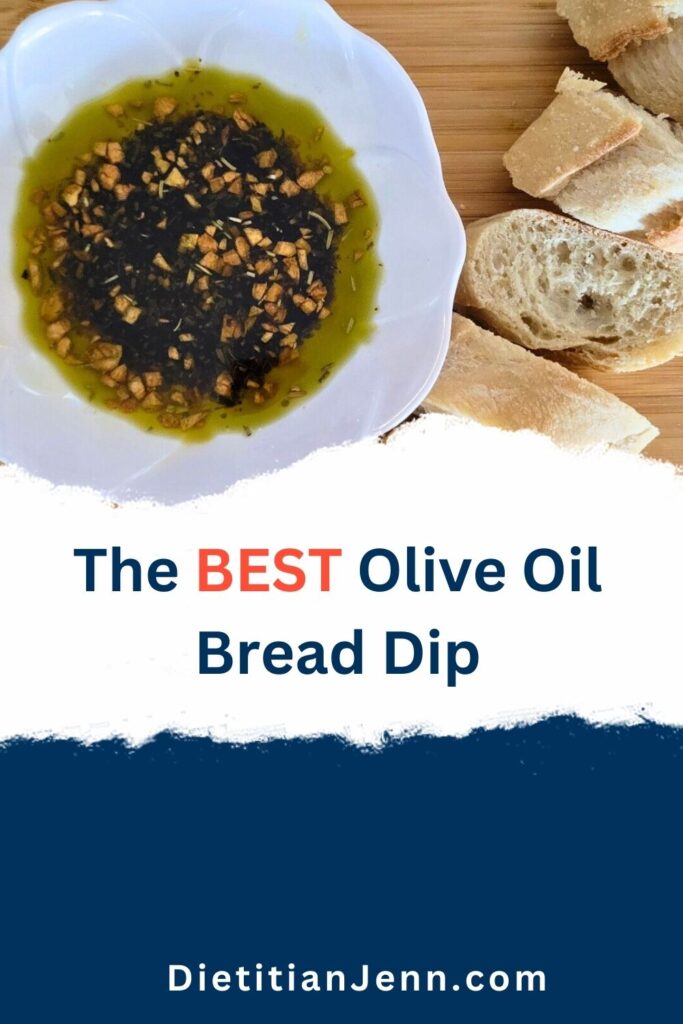 olive oil bread dip in a white bowl stylized like a flower on a light wooden surface, next to a sliced baguette. Text below reads, "the best olive oil bread dip"