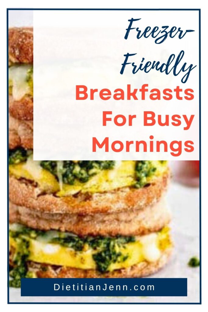 a stack of egg and spinach sandwiches on a white surface. overlaid text reads, "Freezer-Friendly Breakfasts for Busy Mornings"