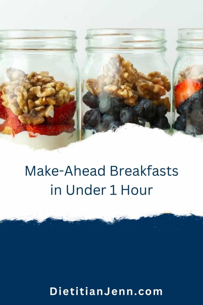 3 clear jars filled with yogurt fruit parfaits. text below reads, "Make-Ahead Breakfasts in Under 1 Hour"