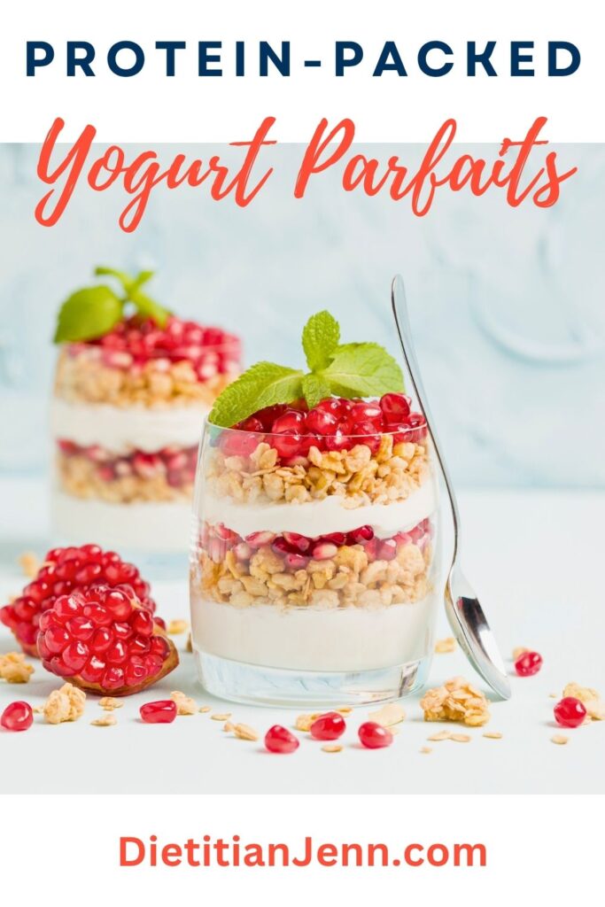 2 yogurt parfaits with raspberries and granola with mint on top. text above reads, "Protein-Packed Yogurt Parfaits"