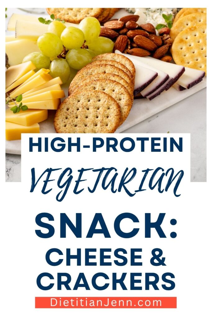 plate with sliced cheese, whole grain crackers, grapes, and almonds. text below reads, "High-Protein Vegetarian Snack: Cheese & Crackers"